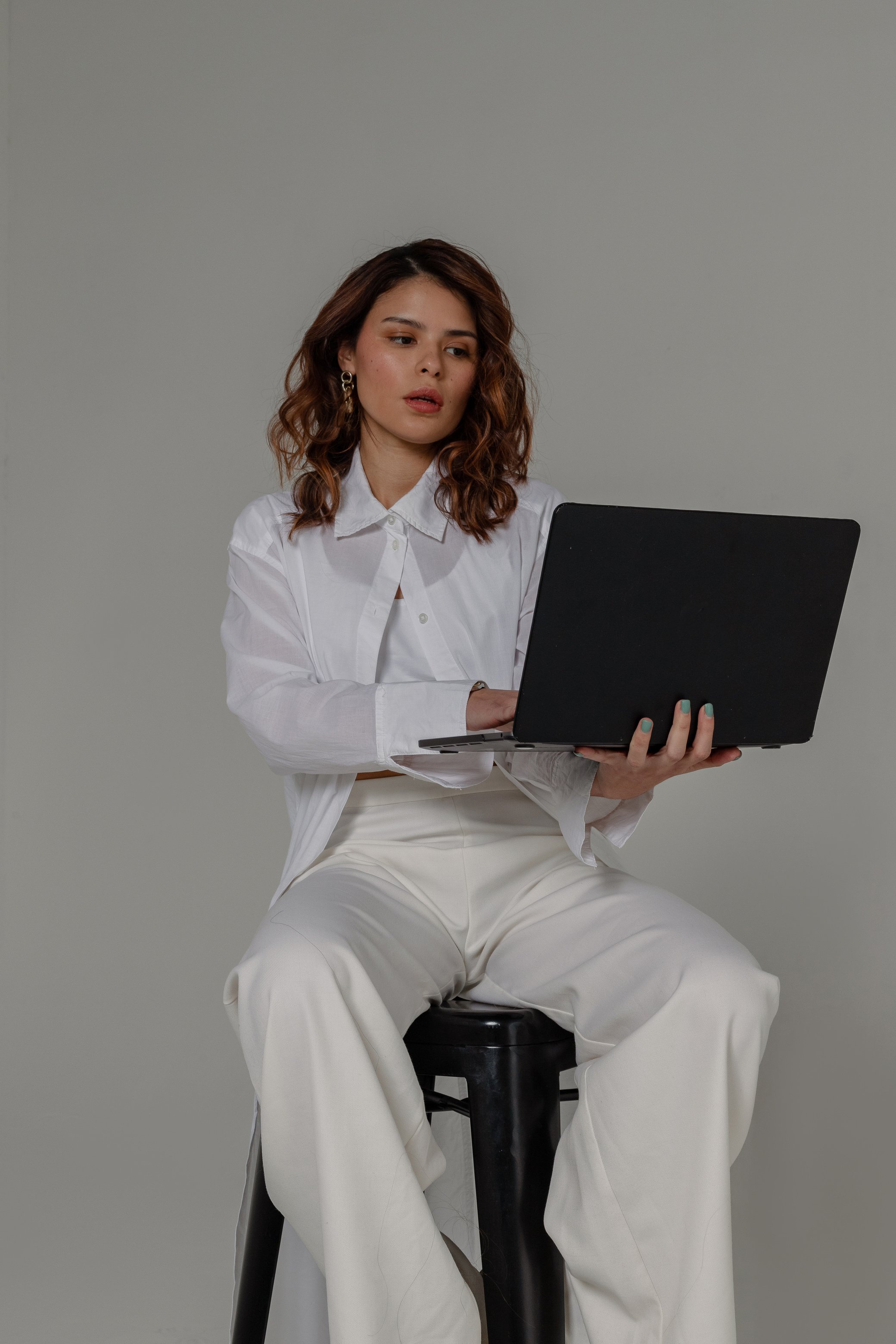 Professional Diverse Team Female Professional with a Laptop